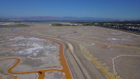 timelapse aerial of marsh besides facebook headquarters in sf bay area