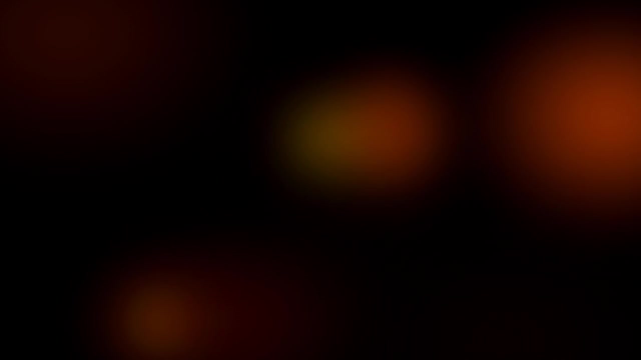 Nền trừu tượng của ánh sáng Bokeh màu cam và vàng rực rỡ