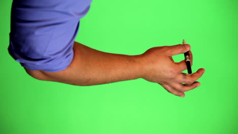 an arm in front of a green screen to be keyed and used at will