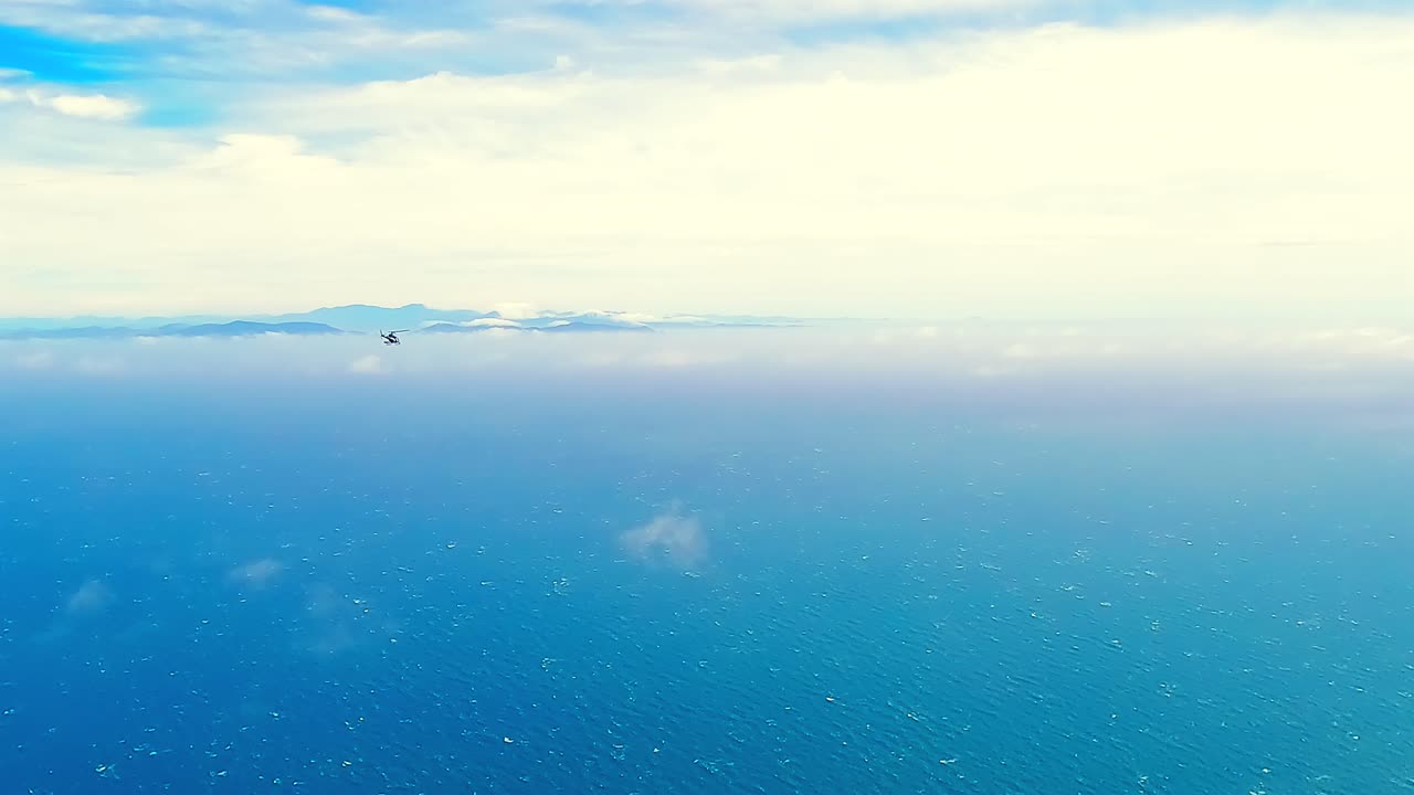 Helicopter flying over the Cook Strait in New Zealand