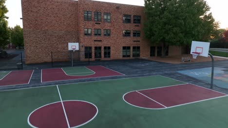 basketball hoops and outdoor playground at american school