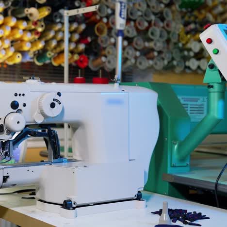 garment factory industrial embroidery machine. footage embroidery machines running fast at textile industry at garment manufacturers