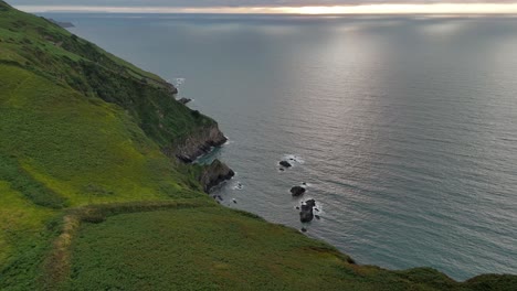 drone flight over the torrs cliffs and rugged coastline – ilfracombe, devon, uk