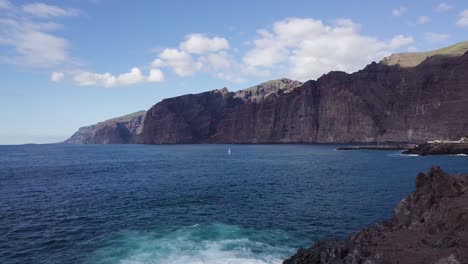 aerial coastline cliff view over blue ocean water seascape in los gigantes town in the santiago del teide tenerife island canary spain