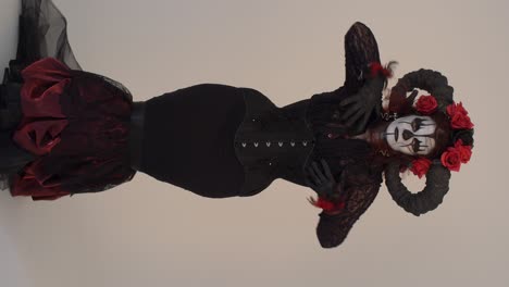 gothic devil woman in red and black costume