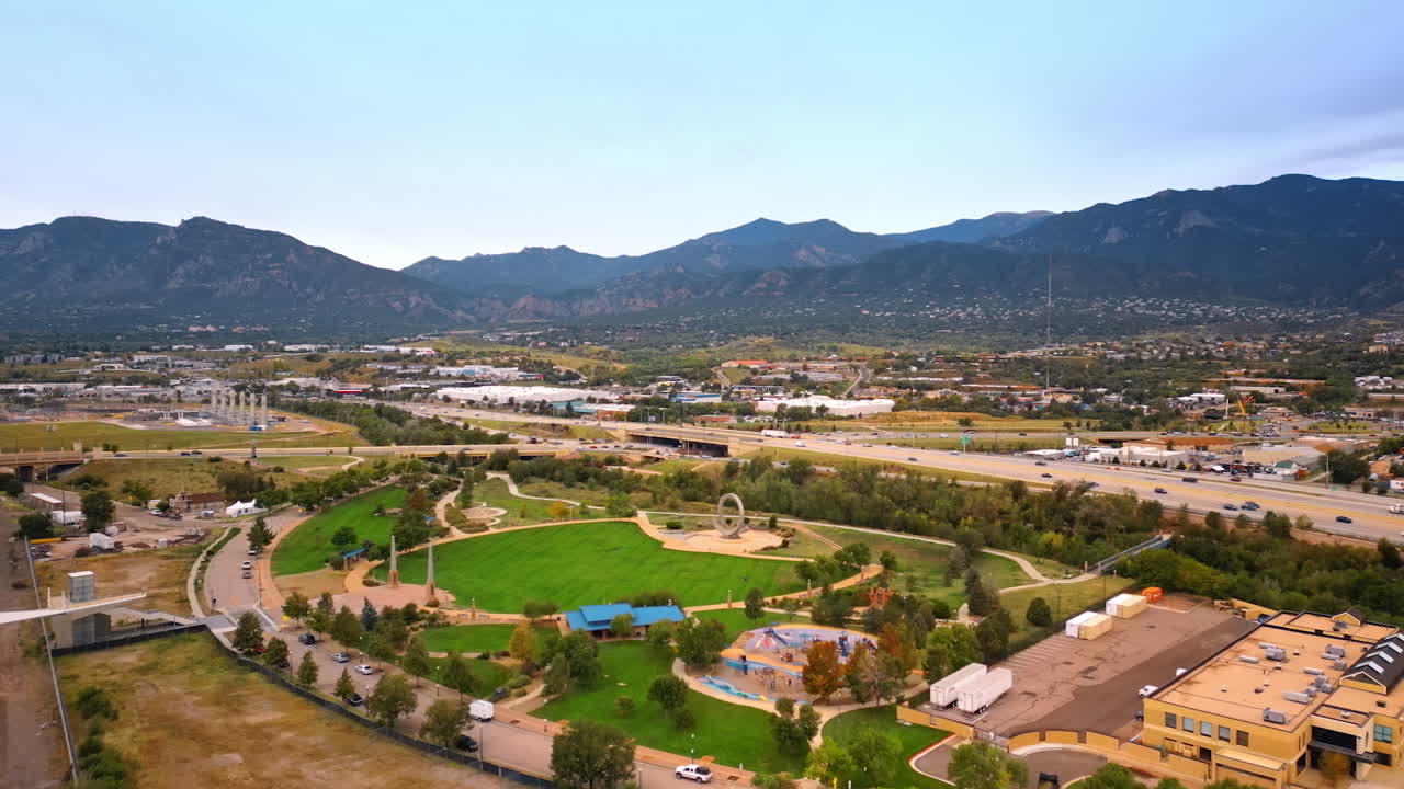 Little green park in the scenery of the city. Drone footage approaching green area in Colorado-Springs, Colorado, USA