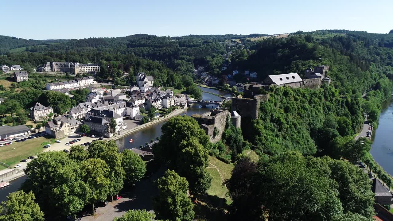 Aerial view of Bouillon Castle, medieval castle in the town of Bouillon in the province of Luxembourg, Belgium, Europe. Sunny summer day, beautiful green scenery.