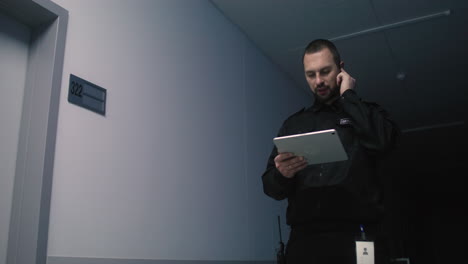 Caucasian man using tablet at night