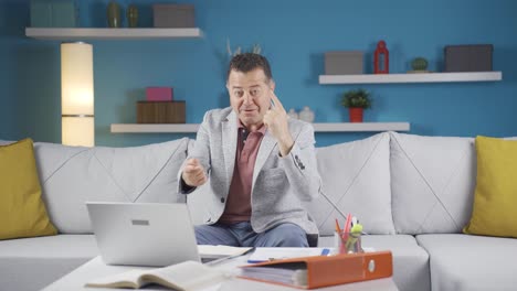 home office worker man expressing his mind and success to the camera.