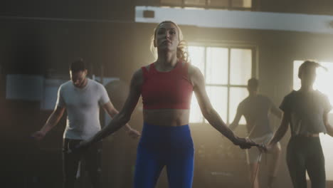 group jumping rope workout in gym