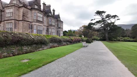 path outside walled garden and 19th century muckross house, landmark in killareny national park, ireland