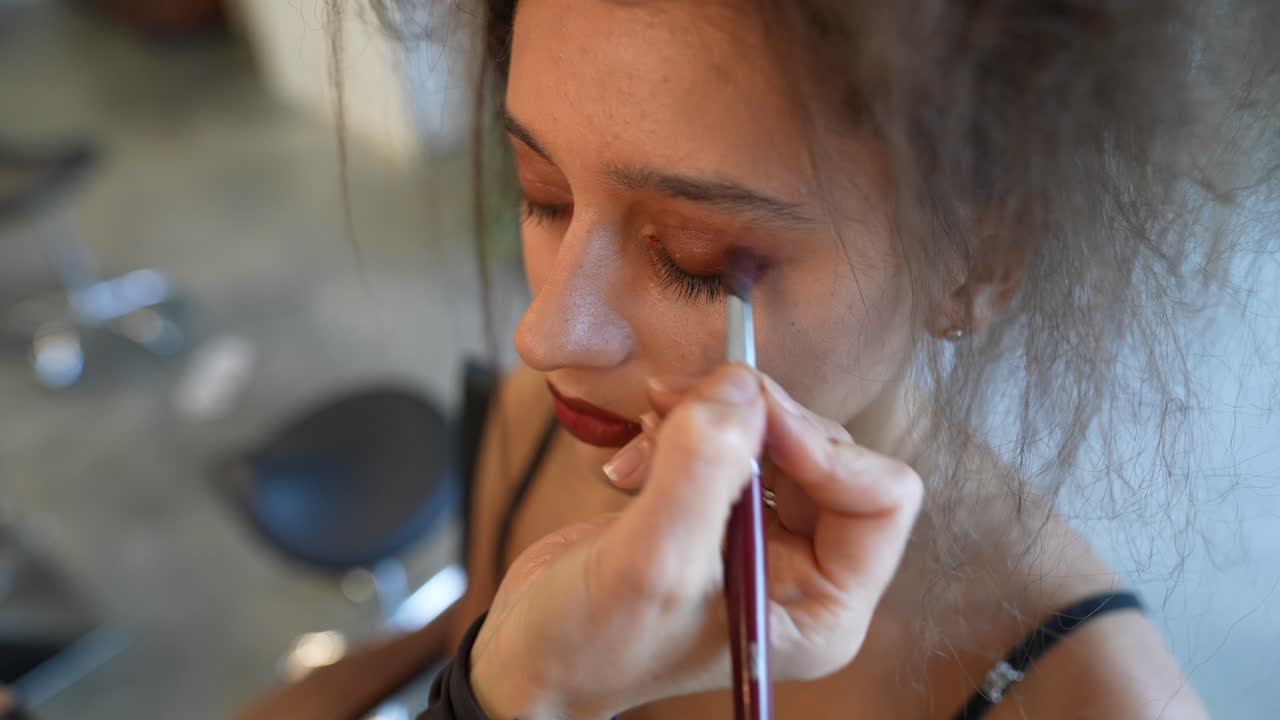 Close Up of Woman Getting Eyeshadow Applied by Makeup Artist