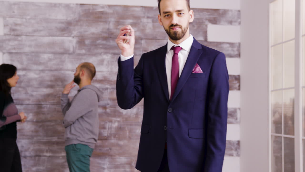 Images of a businessman in a suit with keys