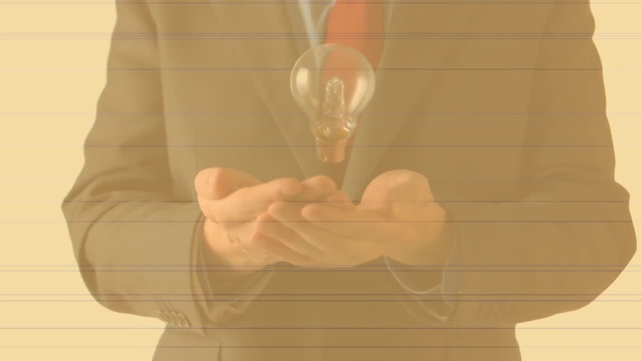 Animation of lightbulb over businessman's hands