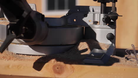 miter saw and sawdust