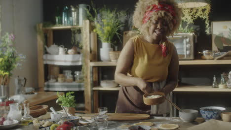 woman baking homemade pastries in a rustic kitchen