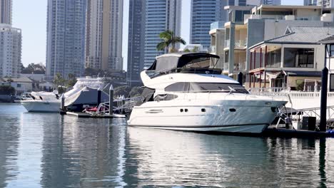 a yacht docked near waterfront buildings