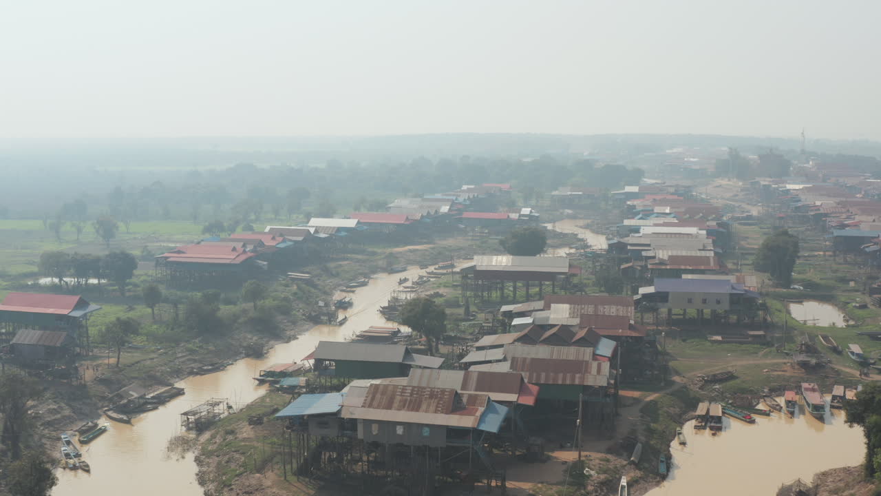 Hazy day over village on stilt along the Tonle Sap river