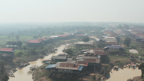 hazy day over village on stilt along the tonle sap river