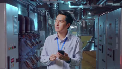 engineer reviewing system in a factory