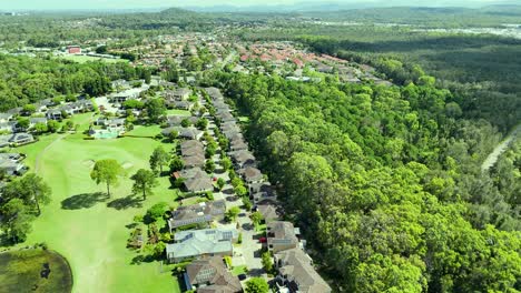 luxury homes and golf course amidst lush greenery