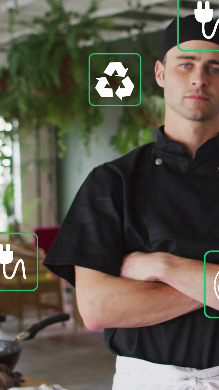 Video verticale: Chef che incrocia le braccia a tavola mentre la telecamera zooma, con icone di energia sopra lo chef.