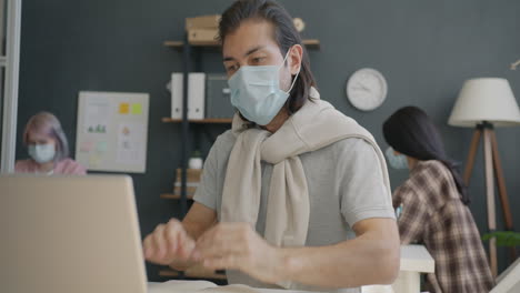 people wearing masks in an office setting