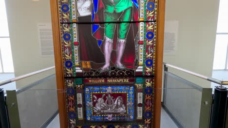 stained glass artwork of william shakespeare in library