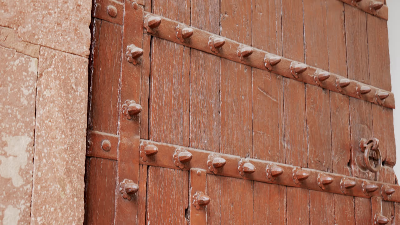 wooden doors at the time of Mughal architecture at delhi, humayun's tomb, day time, new delhi, india. tilt up shot 4k