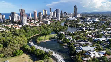 cityscape with river and lush greenery