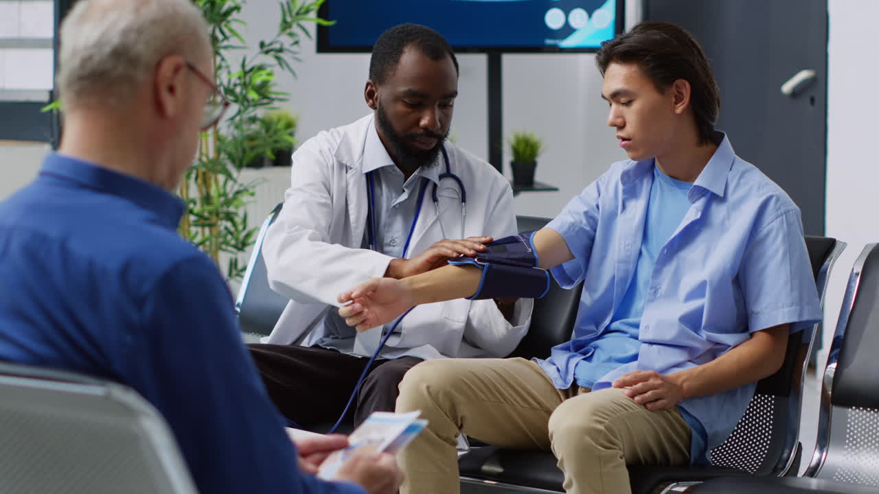 Doctor checking patient's blood pressure