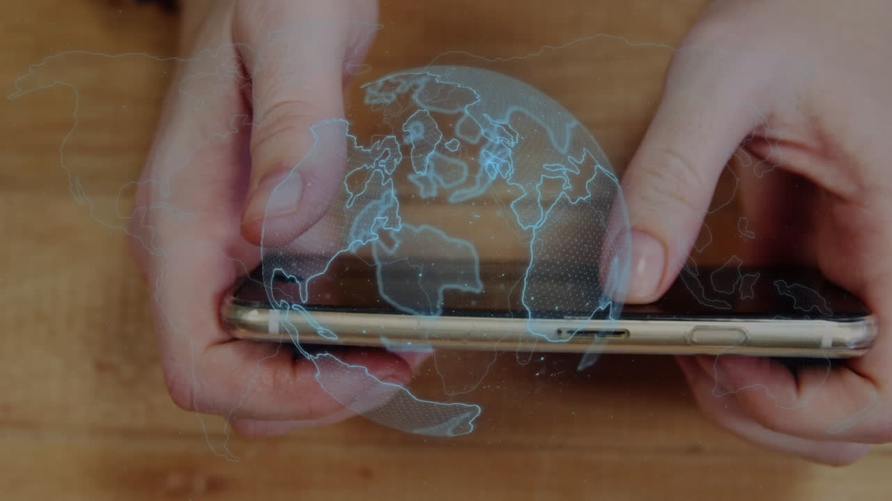 animación del globo giratorio sobre el cierre de las manos usando un teléfono inteligente