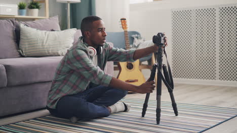 man vlogging from home