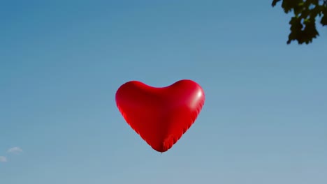 red heart shaped balloon soaring in a bright blue sky, symbolizing love and romance, capturing the essence of valentine's day celebrations and joyful moments of affection