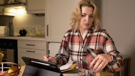 Woman-preparing-inventory-checklist-of-spices