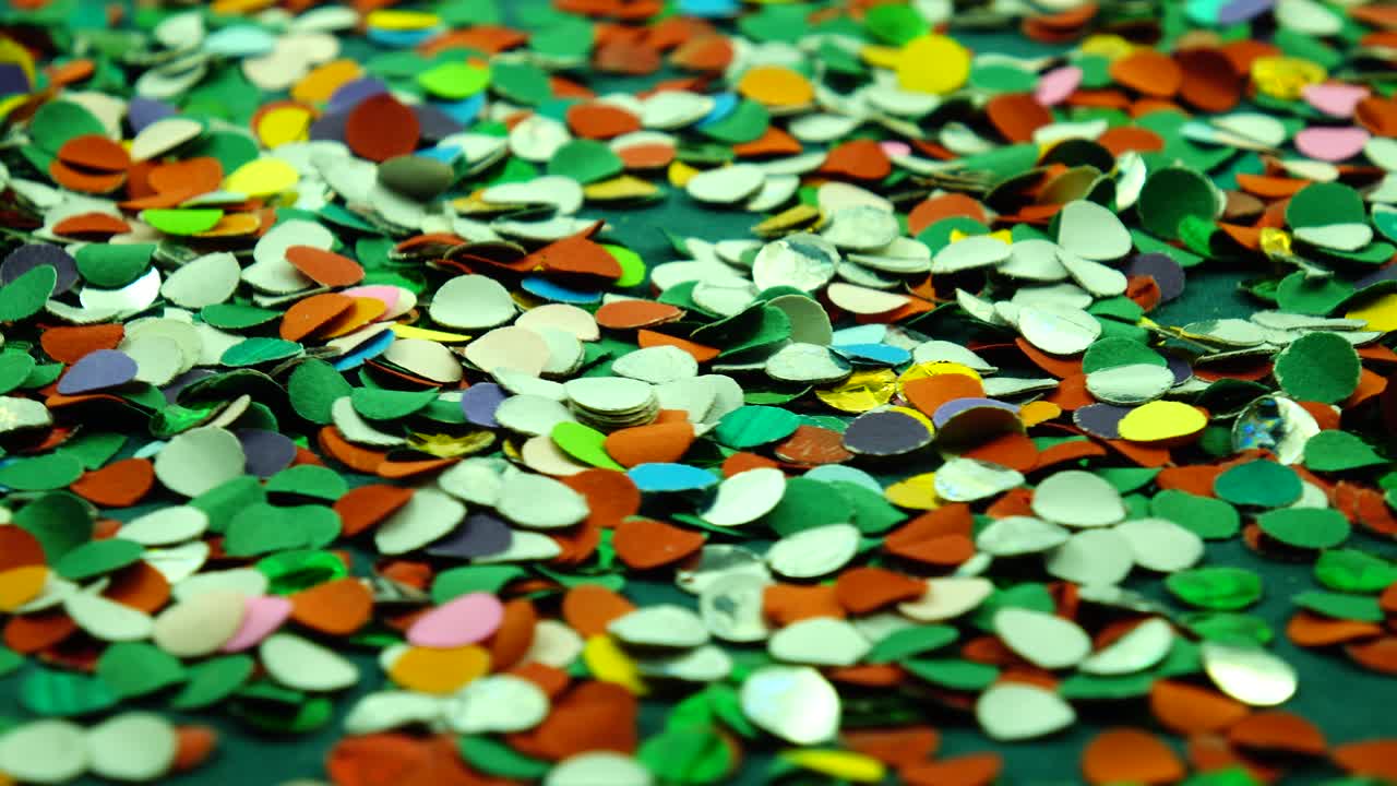 Scattering of  varied color confetti, festive background