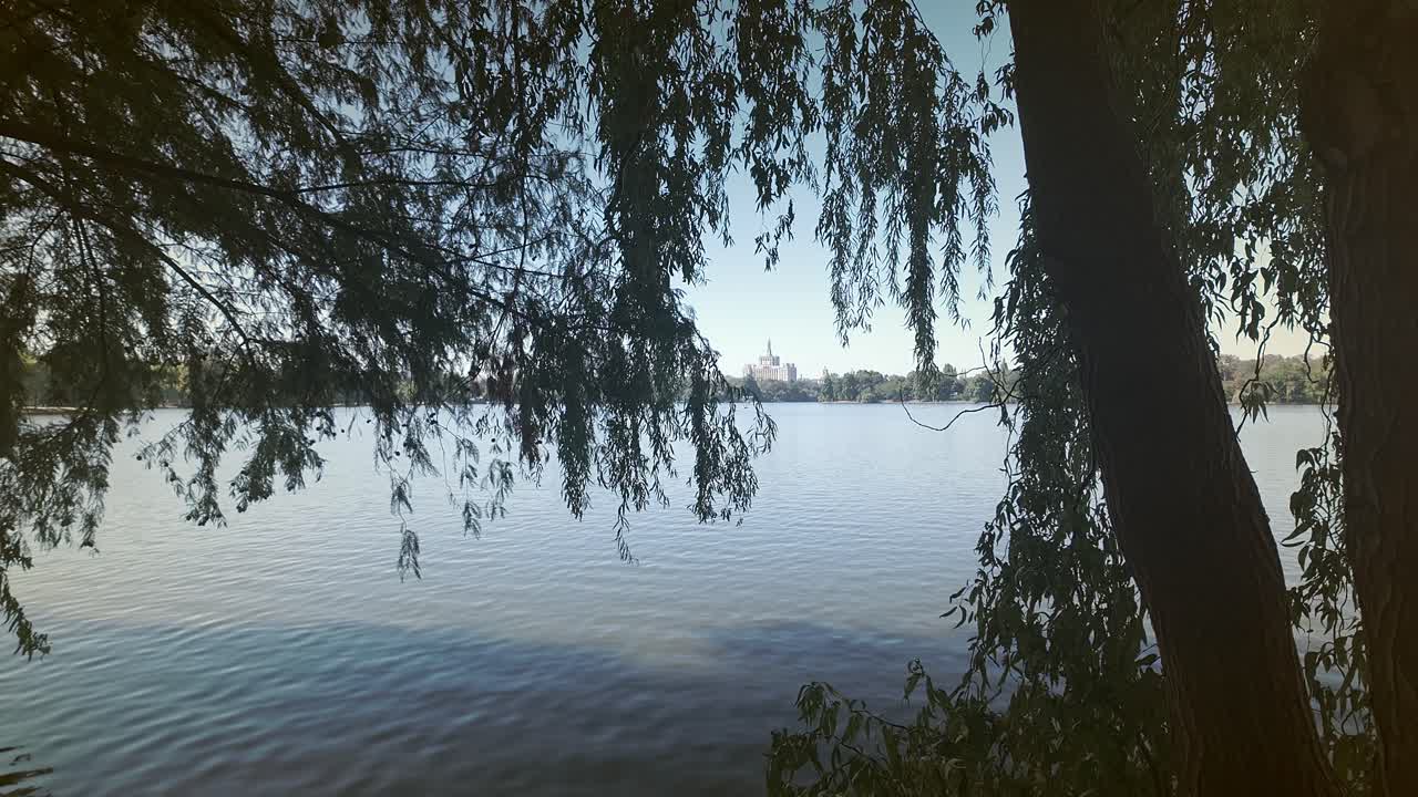 Bucharest House of Free Press landmark building from park lakeside