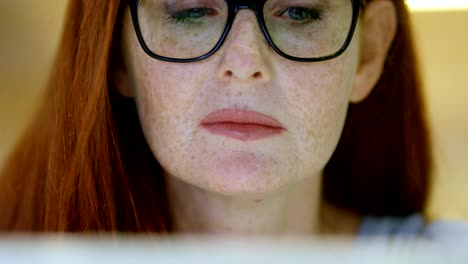 businesswoman using laptop in office 4k