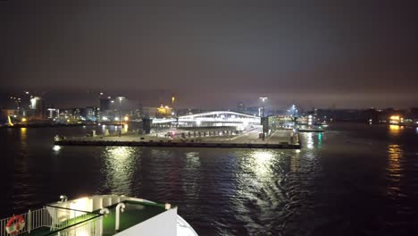 departing from finland, helsinki ferry terminal at night from close distance.