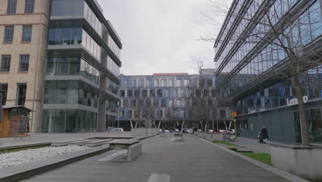 an empty little relax square inside a business park on a mid cloudy day