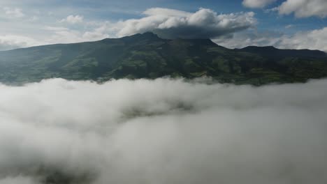 aerial view of rumiñahui volcano through thick white clouds