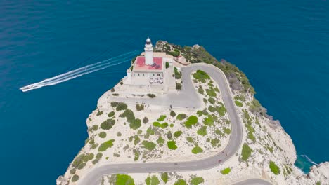 Flying-over-Formentor-Lighthouse-on-rugged-headland-of-Mallorca-coast