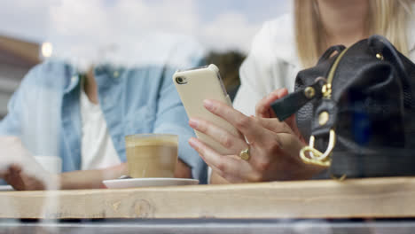 close-up hands using mobile touchscreen device