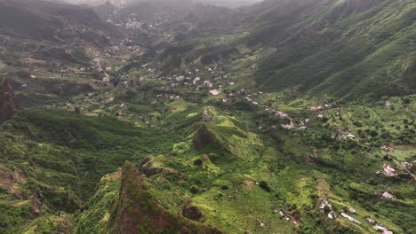 Aerial-View-of-Mountain-Landscape-of-Santiago-Island,-Cape-Verde,-Green-Hills-and-Homes-in-Valley