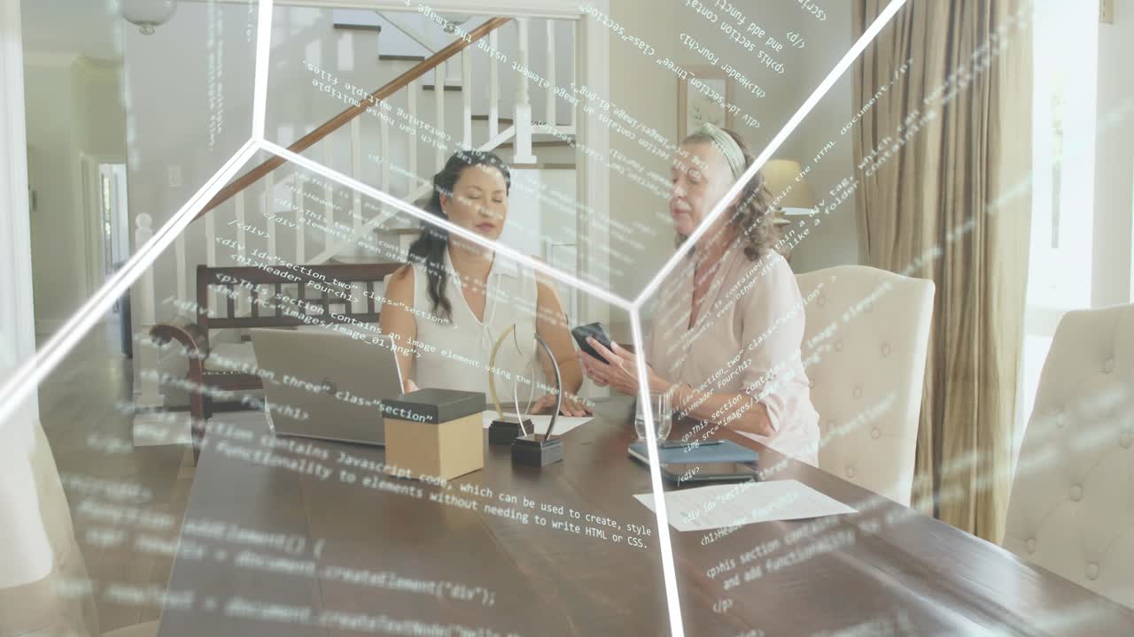 Two women leaning over laptop with right woman showing smartphone, reviewing tech data overlay