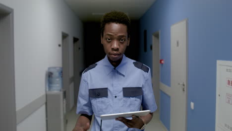 man in uniform working in the corridor