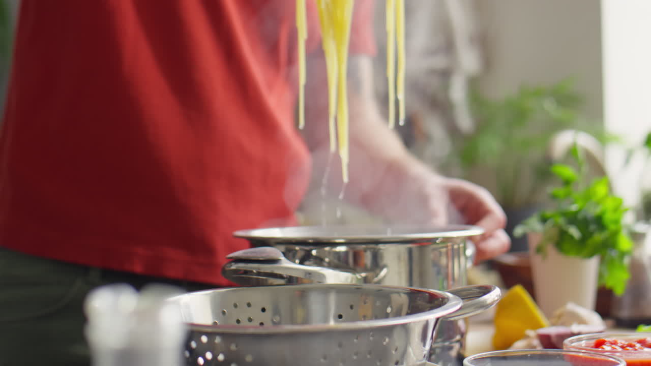 Putting Cooked Pasta in Colander