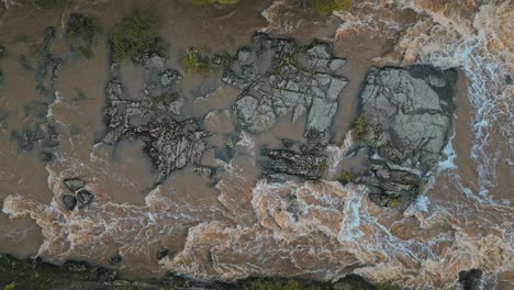 Top-shot-of-rapids-and-rocks-in-Helsinki,-Finland