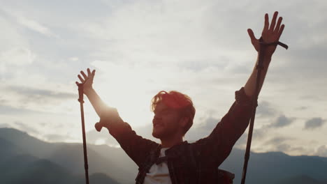 tourist reach mountains peak close up. happy guy celebrate victory success hike