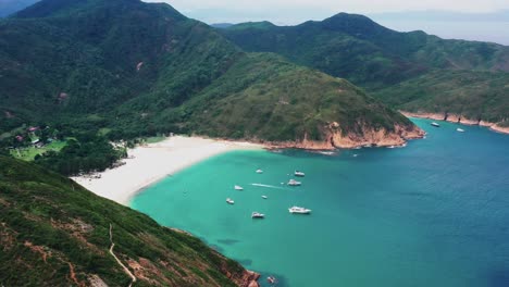 aerial view over anchored sailing boats sui kung hong kong tropical turquoise island bay landscape